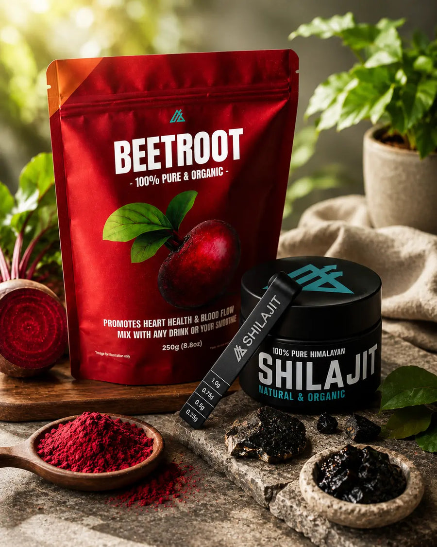 Red package of organic beetroot powder and black container of Shilajit on a wooden surface with plants in the background.