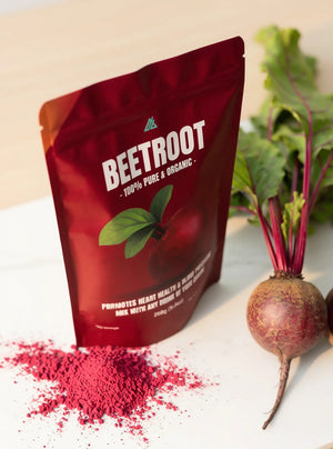 Beetroot powder packaging with fresh beets on a light background