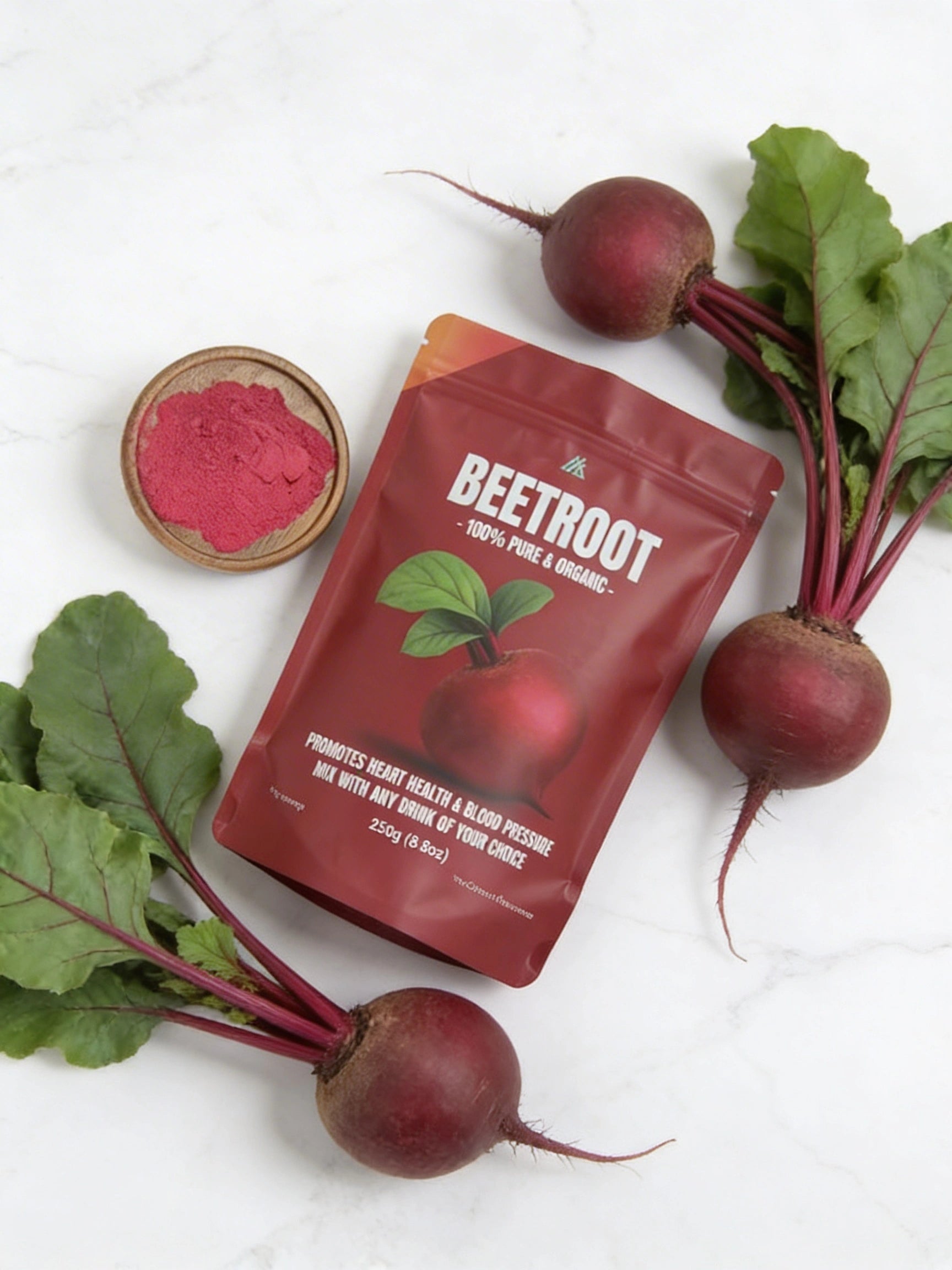 Beetroot powder packaging with fresh beetroots on a white background
